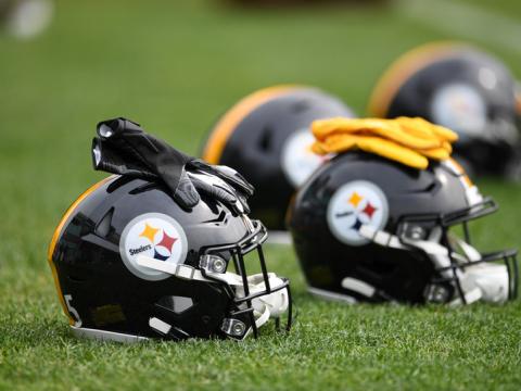 A picture of Steeler helmets and gloves.